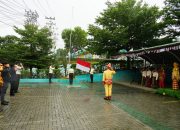 PLN UPT Palu Gelar Upacara HUT ke-80 RI di Tengah Guyuran Hujan